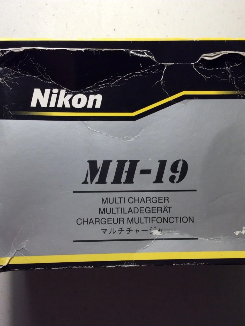Nikon Battery Charger and 3 Nikon Batteries